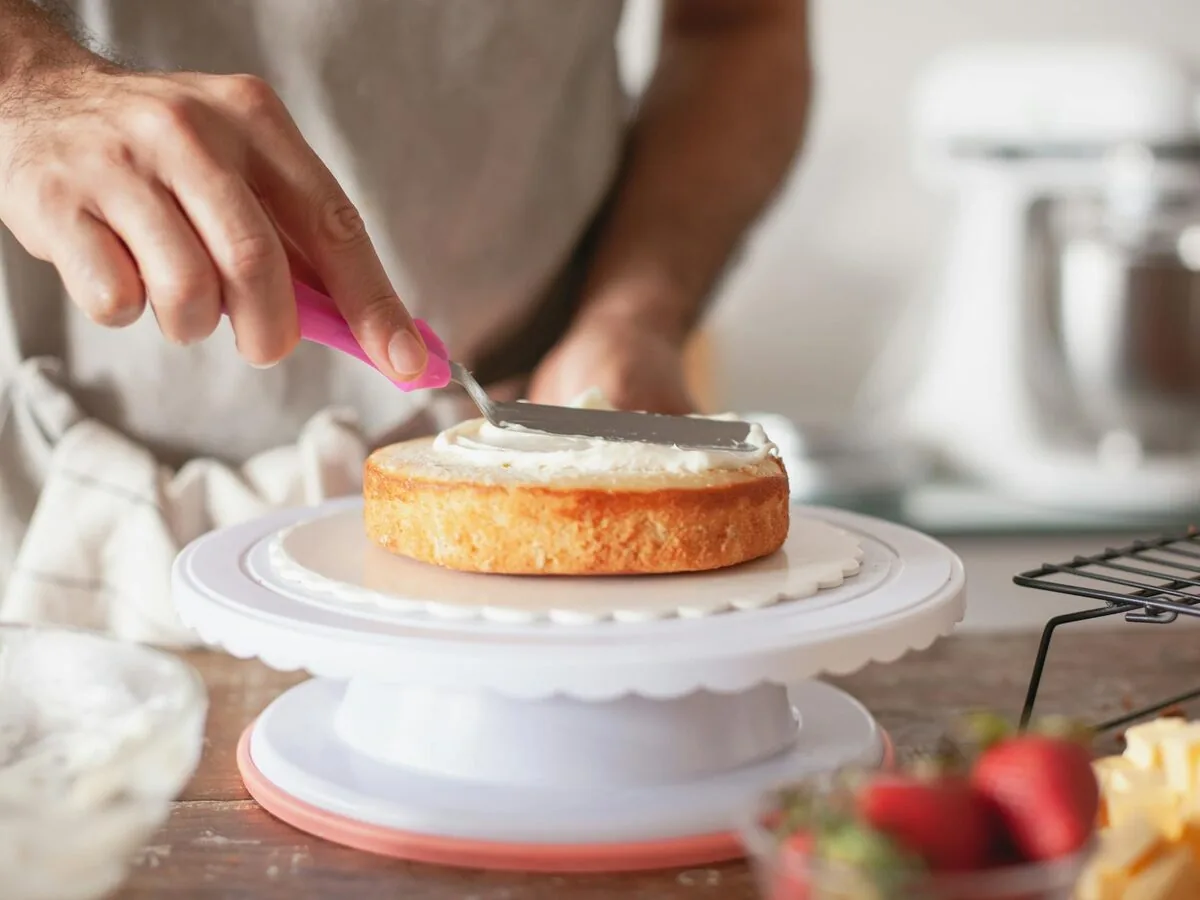 Vanilla cake ingredients arranged for baking on a kitchen surface.